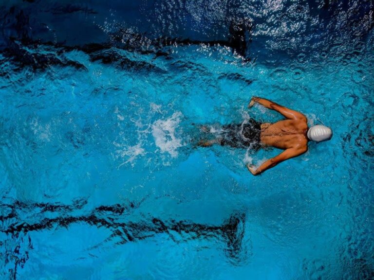 Man Swimming Laps in Pool